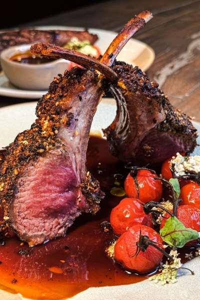 Emma's Creekside Farm: True Farm to Table at Rosen Shingle Creek 6 Seared lamb chops from A Land Remembered plated with fresh on-the-vine tomatoes from Emma's Creekside Farm.