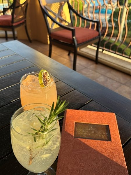 Two mocktails glistening in the golden hour sun at Cala Bella at Rosen Shingle Creek.