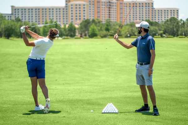 Chris Spalla providing a golf lesson at Rosen Shingle Creek resort in Orlando.
