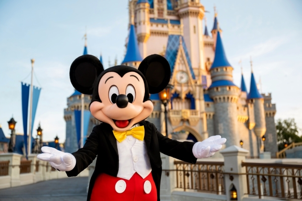 Thanksgiving Without Cooking: Rosen Shingle Creek is a Holiday Escape 6 Mickey Mouse standing in front of Cinderella Castle at Magic Kingdom.
