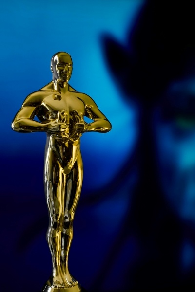 Have a Reel Good Time at the 2025 Florida Film Festival 3 A gold Oscar statue against an out-of-focus dark blue and black background. The Florida Film Festival is an Oscar qualifying festival.