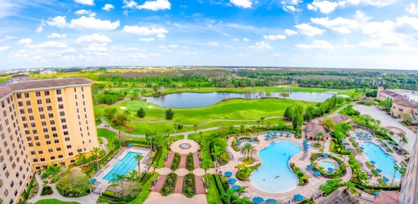 A panoramic shot of the four pools, golf course, lake, and surrounding areas at Rosen Shingle Creek in Orlando.