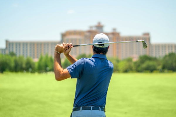 Chris Spalla, Director of Golf Instruction at Shingle Creek Golf Academy, swinging a golf club at Rosen Shingle Creek resort in Orlando.