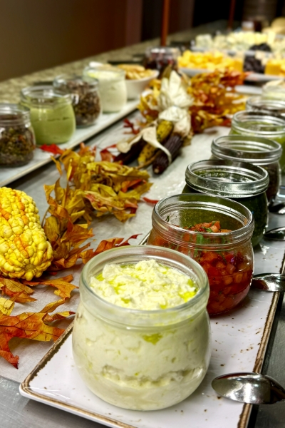 Rows of jars with spreads and dips at the Orlando Thanksgiving buffet at Rosen Shingle Creek.