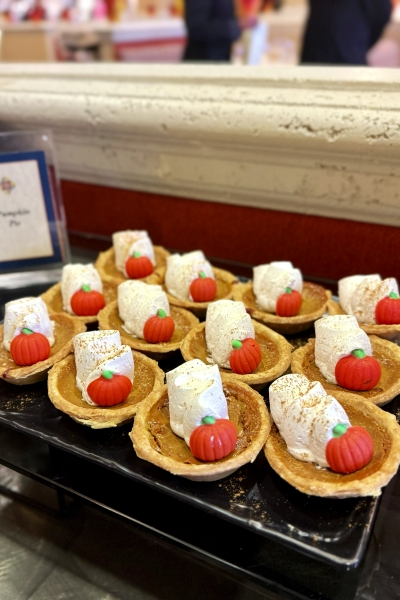A display of mini pumpkin pies topped with whipped cream and candy pumpkins at the Thanksgiving buffet at Rosen Shingle Creek.