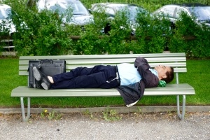 Man taking nap on bench