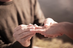 Marriage proposal with ring.